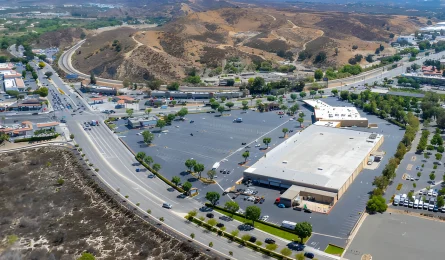 Aerial view of a retail center in Santa Clarita, CA, financed by Buchanan Mortgage Holdings.